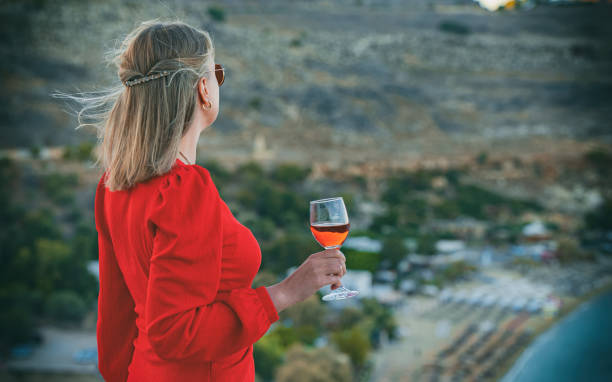 Choosing the perfect footwear to match a wine red dress.